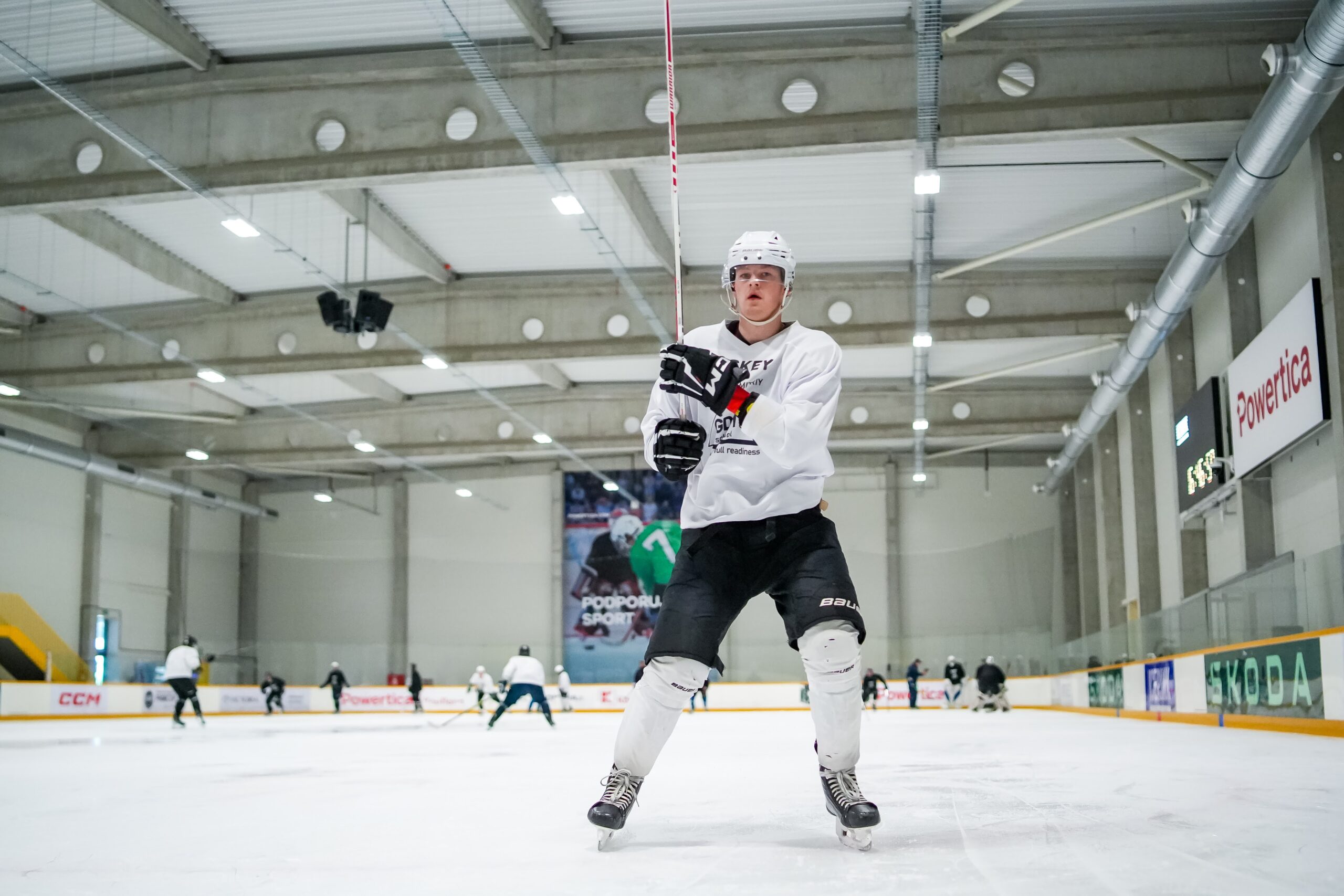 A player practicing stickhandling on the ice