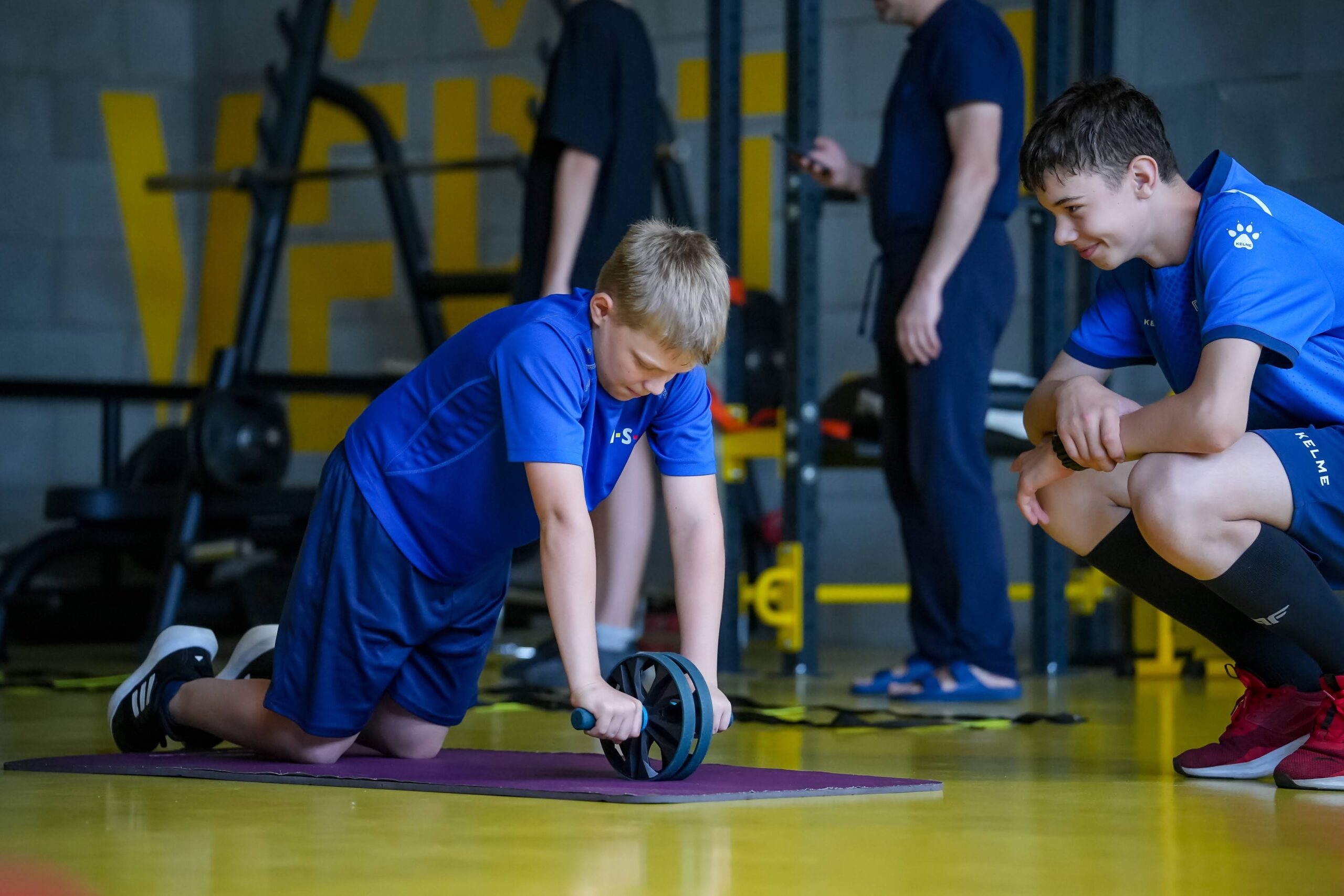 Players doing a strength exercise during off-ice training