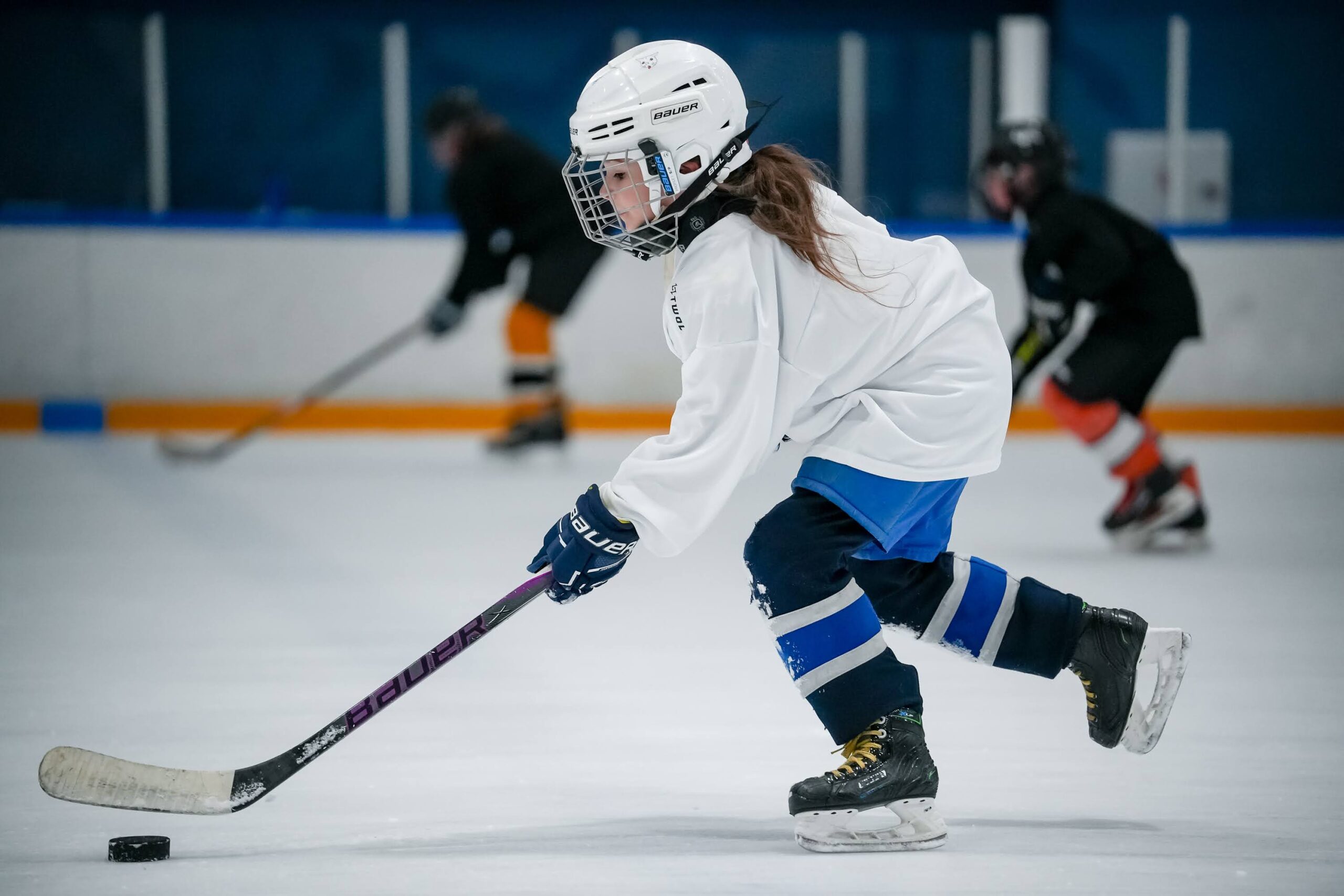 A player skating with the puck during training