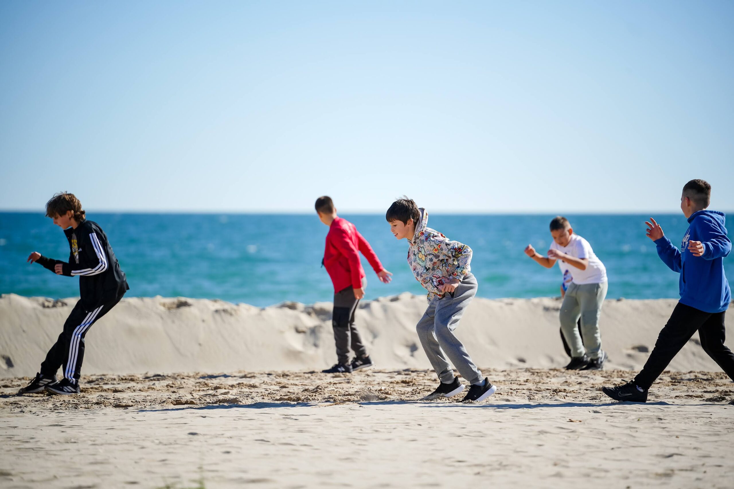 Players doing off-ice conditioning on the beach