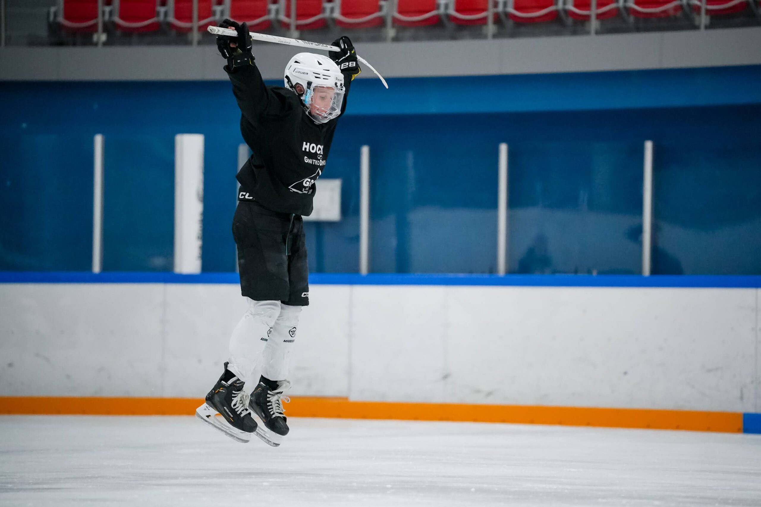 A player jumping during hockey skating practice